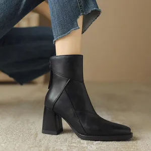 Elegant black high-heeled ankle boots with chunky block heel and square toe