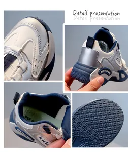 Close-up detail of breathable girls running shoes with silver and blue accents.