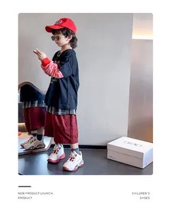 Breathable mesh children's athletic sneakers for girls, shown on a young model in a studio
