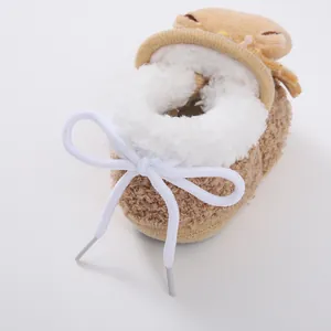 Close-up of soft plush lining and sherpa fleece texture on baby winter walker shoes.