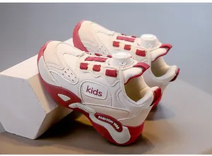 Detail of cream and red girls' breathable mesh running shoes with rotary dial lacing system.