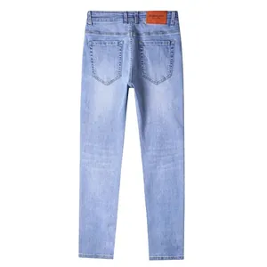 Detailed back view of men's slim fit stretch light blue denim straight jeans for work