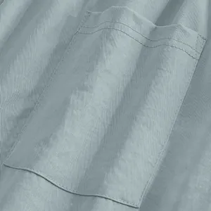 Close-up macro detail showing pocket stitching and linen-like fabric of men's casual pants