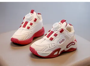 Detailed view of white and red girl's sports shoes featuring a convenient rotary dial