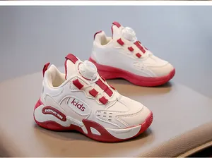 Close-up of red and white children's breathable mesh sneakers with rotary buckle laces