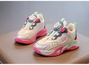 Close-up of girls breathable mesh sports shoes with pink soles and twist buckle