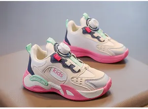 Close-up detail of girls' pink and white mesh breathable running sneakers with dial closure