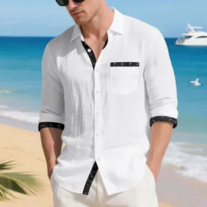Detail of white linen shirt for men with black bird print trim on pocket and cuffs