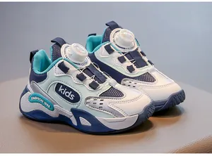Detail view of kids' breathable mesh running shoes with a white rotating buckle closure