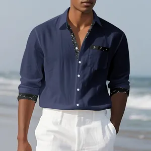 Detailed view of navy blue linen shirt with patterned cuffs and pocket for men