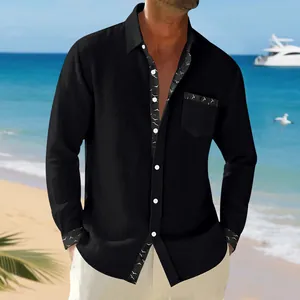 Casual men's black linen shirt shown in beach setting with bird print trim details