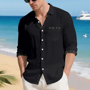 Close-up detail of men's black linen long sleeve shirt with unique printed trim accents