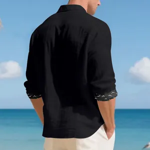 Back view of a casual black linen shirt for men with seagull printed inner cuffs at beach