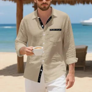 Detail view of a khaki linen shirt featuring a unique patterned trim on the beach.