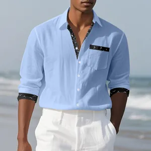 Detailed view of blue linen long-sleeved men's shirt with printed collar and cuffs