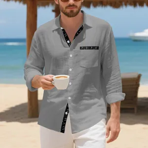 Detail of men's grey linen shirt with unique bird print trim on collar and pocket.