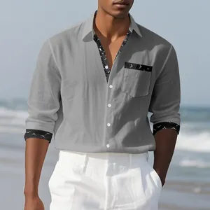 Detail view of grey men's linen casual shirt with decorative bird print cuffs and pocket.