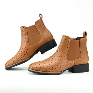Side view detailing the ostrich pattern leather texture on brown men's Chelsea boots