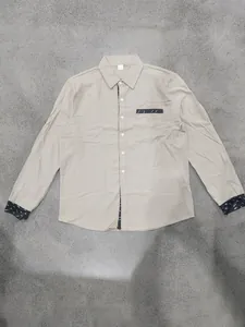 Khaki long-sleeved linen shirt for men featuring decorative dark patterned cuffs and chest pocket