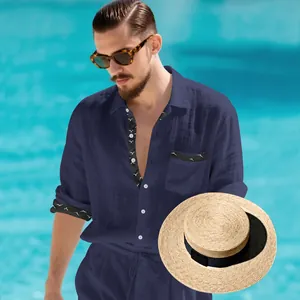 Detailed view of navy blue linen resort shirt featuring unique patterned collar and cuff trim