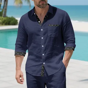 Close-up of navy blue linen resort shirt with seagull print trim on collar and cuffs.