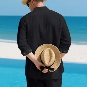 Back view of a black linen blend casual shirt with printed cuffs for vacation