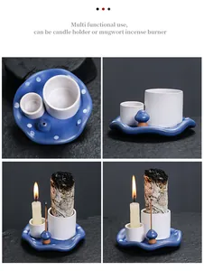 Detail of blue mushroom ceramic incense burner and candle holder with white sage.