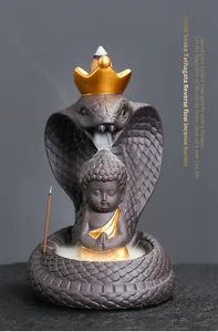 Purple clay cobra and Buddha statue backflow incense burner shown with smoke detail