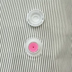 Durable striped fabric vacuum storage bag featuring a leak-proof air valve and pink seal
