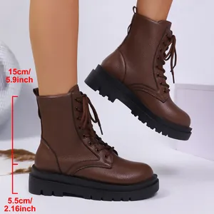 Detailed view of brown lace-up ankle boots with 5.5cm thick soles and 15cm shaft