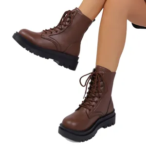 Brown pebbled leather combat boots for women with thick platform soles and laces.
