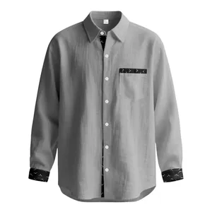 Detailed view of gray linen-blend men's shirt with contrast black patterned trim details