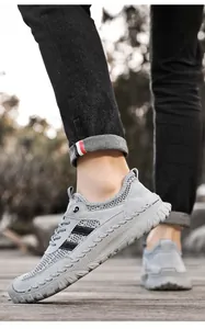 Detail view of men's breathable grey mesh sneakers for outdoor sports and leisure