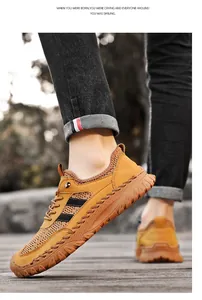 Close-up of yellow breathable mesh men's sports shoe for summer outdoor travel