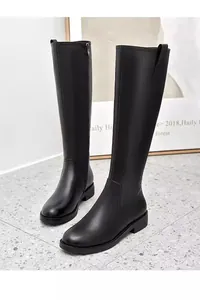 Elegant black knee-high leather boots with minimalist side zipper and flat heel.