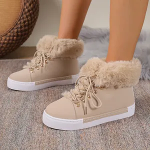Women's beige snow boots with thick faux fur trim and lace-up front for winter