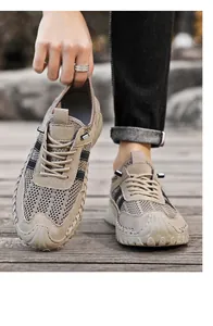 Close-up of breathable khaki mesh men's sports sneakers showing lightweight soft soles