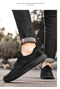 Detailed side view of men's black breathable mesh sneakers for summer outdoor walking.