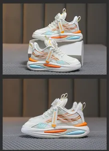 Vue latérale de baskets en mesh blanc respirantes avec accents orange et laçage rotatif.