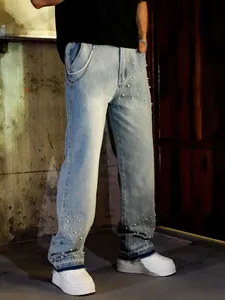 Close-up showing the pearl beading and decorative chain on men's loose straight-leg denim jeans