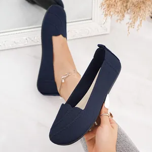 Detailed view of navy blue breathable flyknit flat slip-on shoes with round toe design