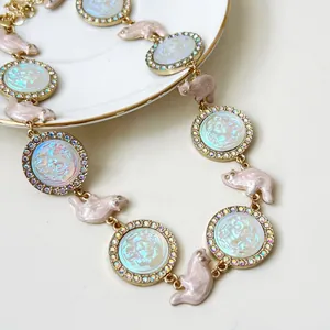 Detail of relief beauty portrait necklace with colorful rhinestones and resin animal links.