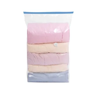 Large transparent vacuum storage bag filled with colorful folded quilts and clothes