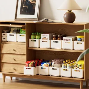Minimalist white retractable plastic storage boxes for home organization and snacks.
