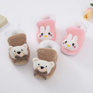 Soft plush baby winter booties with cartoon bear and rabbit designs and fleece lining