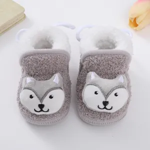 Detail of cute grey cartoon fox baby booties with warm fleece lining and soft plush texture