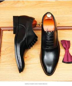 Close-up of premium black leather Oxford shoes for men with classic lace-up design