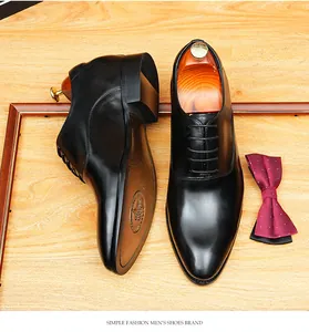 Close-up of high-quality black leather Oxford shoes with a hidden height increase design