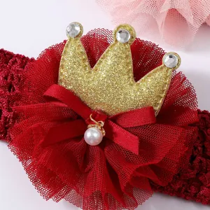 Cute red lace baby headband with a gold glittery crown and silk bow accessory for parties