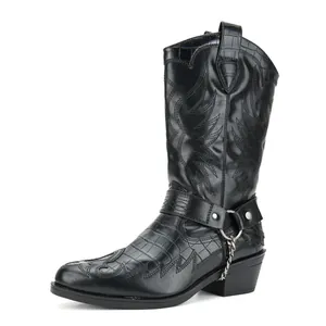 Detailed side view of black crocodile embossed western cowboy boots with metal chain